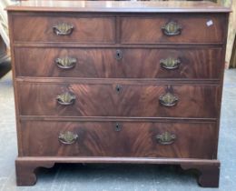 A George III mahogany chest of two short over three graduating drawers, on bracket feet,