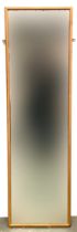 A gilt painted rectangular long mirror, 141x41cm