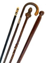 Four walking canes, one with silver collar