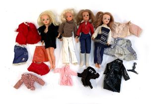 Four vintage Pedigree Sindy dolls, together with a small quantity of genuine Sindy branded clothes