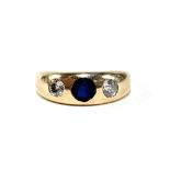 A gold gypsy ring set with diamonds and a central sapphire, marks rubbed but tests as 14ct or