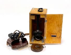 A pair of Karl Zeiss Deltrintem binoculars in case; together with a leather cased surveyors tape and