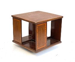 An Edwardian mahogany and crossbanded rotating desk top bookshelf, 35x35x32cmH