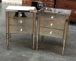 A pair of gilt painted and mirrored bedside cabinets, each with three drawers (af), 51x41x72cm