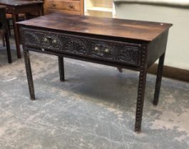 An 18th century and later oak size table, with demilune carved frieze drawer, on carved square