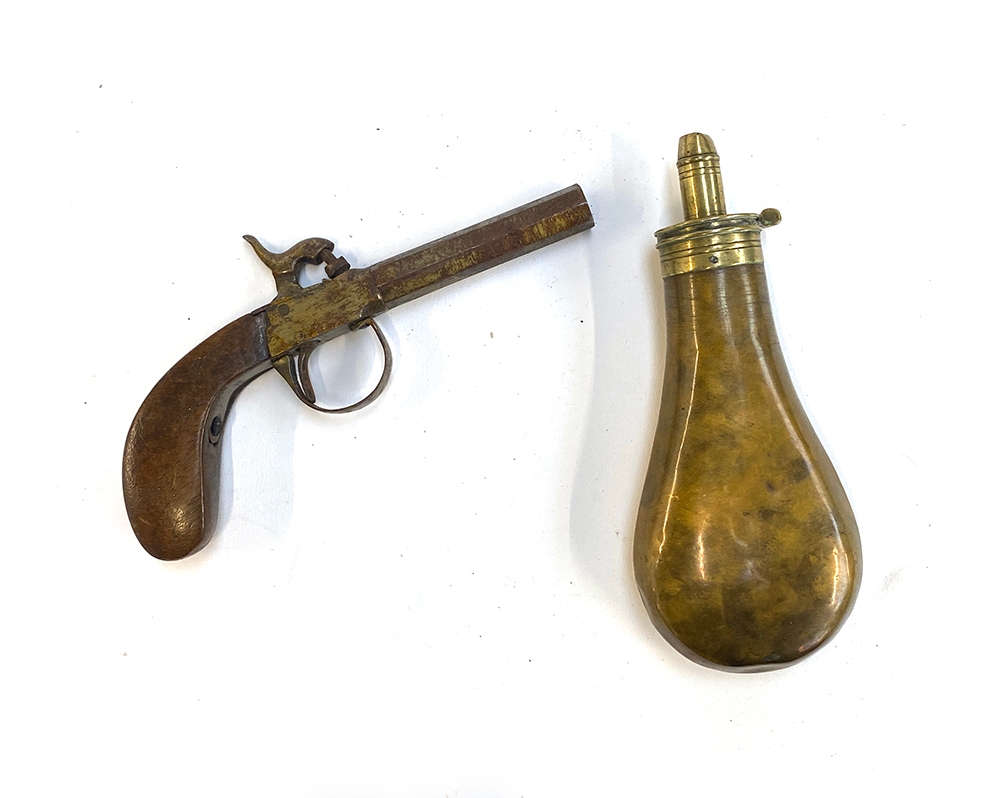 A 19th century percussion pistol; together with a brass powder horn