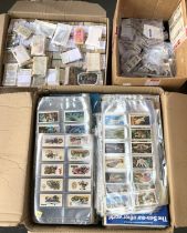 A large quantity of cigarette and tea cards in three boxes to include Ogdens, Priory, Typhoo, etc