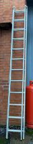 A two section aluminium extending twelve rung ladder, each section 350cmL