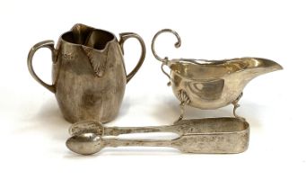 A silver double spouted milk jug by Arthur Sibley, London 1872; together with an early 20th