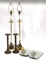 A pair of mirrored wall sconces; a pair of metal pricket candle sticks; and a pair of gilt metal