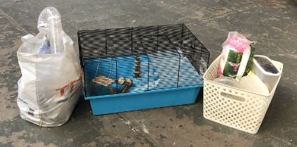 A hamster cage and accessories