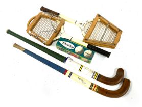 Two vintage tennis rackets with wooden presses, together wioth two vintage hockey sticks and 4