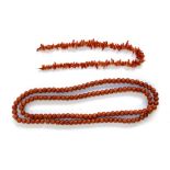 A long apple coral bead necklace, each bead approx. 0.9cmD, 53cmL; together with a branch coral