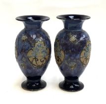 A pair of Royal Doulton baluster form stoneware vases, 27.5cm high