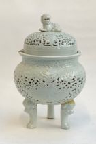 A Chinese blanc de chine porcelain censer (af), of pierced form, the lid surmounted by a foo dog,
