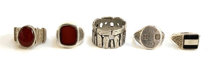 Five silver rings, two set with carnelian, one in the form of Stonehenge, all fully hallmarked,