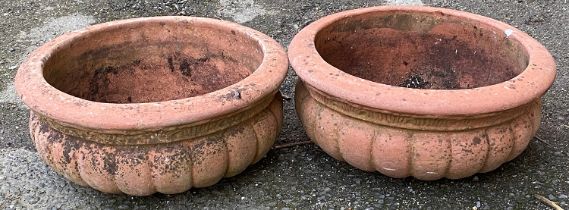 A pair of shallow terracotta planters, 40cmD 18cmH