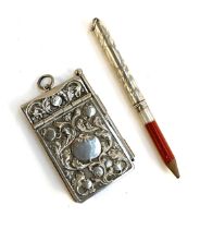 An Edwardian silver plated notebook and pencil; together with a hallmarked silver pencil holder