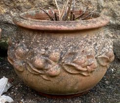 A large terracotta plant pot with a fruit design, 44cmW