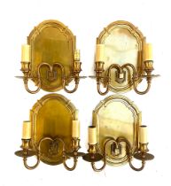 Interior design interest: A set of four two arm wall sconces with brushed brass effect backplates,