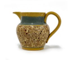 A small 19th century speckled agate ware jug, 8.5cmH