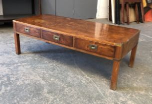 Interior design interest: A campaign style yew veneer coffee table, three drawers to either side,