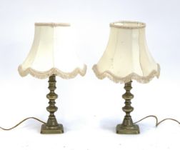 A pair of brass table lamps with shades, 42cmH