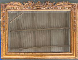 A carved gilt mirror with cresting, bevelled plate, 92x69cm, together with an oak framed rectangular