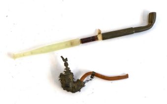 Two opium pipes, one with carved jadeite mouthpiece, the other carved wood and brass, the bowl