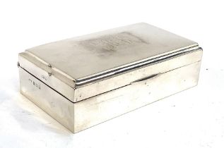 A silver cigarette box, Birmingham 1922, 16cm wide