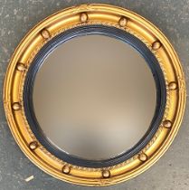 A Regency style convex mirror with gilt frame and bobble moulding, 41cmD