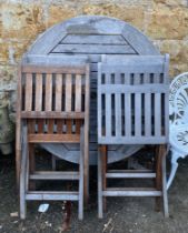 A set of four slatted teak garden chairs and circular table, 110cmD