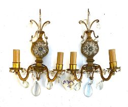 Interior design interest: A pair of gilt metal and cut glass two arm wall sconces with central