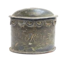 A 19th century painted lead tobacco jar with applied swags and painted pipe detail, 14cmH