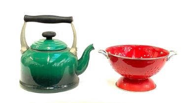 A Le Creuset green enamel kettle, together with a red enamel colander