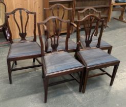 A set of five 18th century Hepplewhite style mahogany dining chairs, one carver, one square