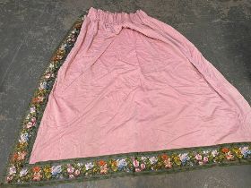 A pair of lined pink chintz curtains with green floral border, 225cm wide ungathered, 200cm drop