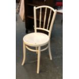 A white painted bentwood chair