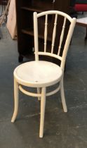 A white painted bentwood chair