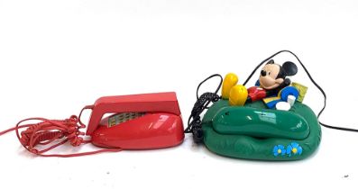 A Disney Mickey Mouse novelty telephone, together with one other
