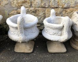 A pair of composite stone two piece urn style planters, 54cmH