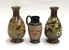 A pair of Doulton 'Impasto' stoneware vases, 24.5cm high; together with a Doulton Lambeth