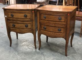 A pair of serpentine bedside tables, of recent manufacture, each with two drawers, 56x41x74cmH