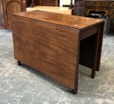 A George III mahogany drop leaf table, on square moulded legs