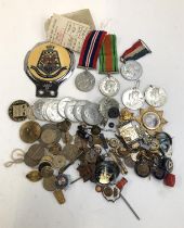 A mixed lot to include WWII Defence Medal, War Medal, George VI coronation medals, George V silver