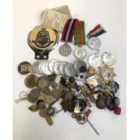 A mixed lot to include WWII Defence Medal, War Medal, George VI coronation medals, George V silver