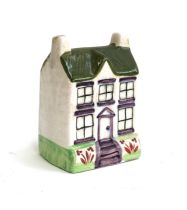 A Staffordshire style cottage moneybox, 10cmH