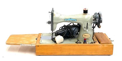 A vintage Victor Deluxe sewing machine with Hillman motor