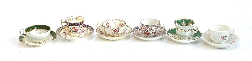 A small lot of 19th century and later hand painted teacups and saucers
