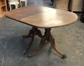 A Regency D end mahogany dining table, twin pedestals, with swept legs, 105cmW, each section approx.